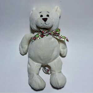 Ganz Peace Bear plush toy with an embroidered peace symbol on its foot.